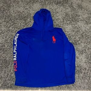 Long sleeve hooded tee shirt with writing on the sleeve.